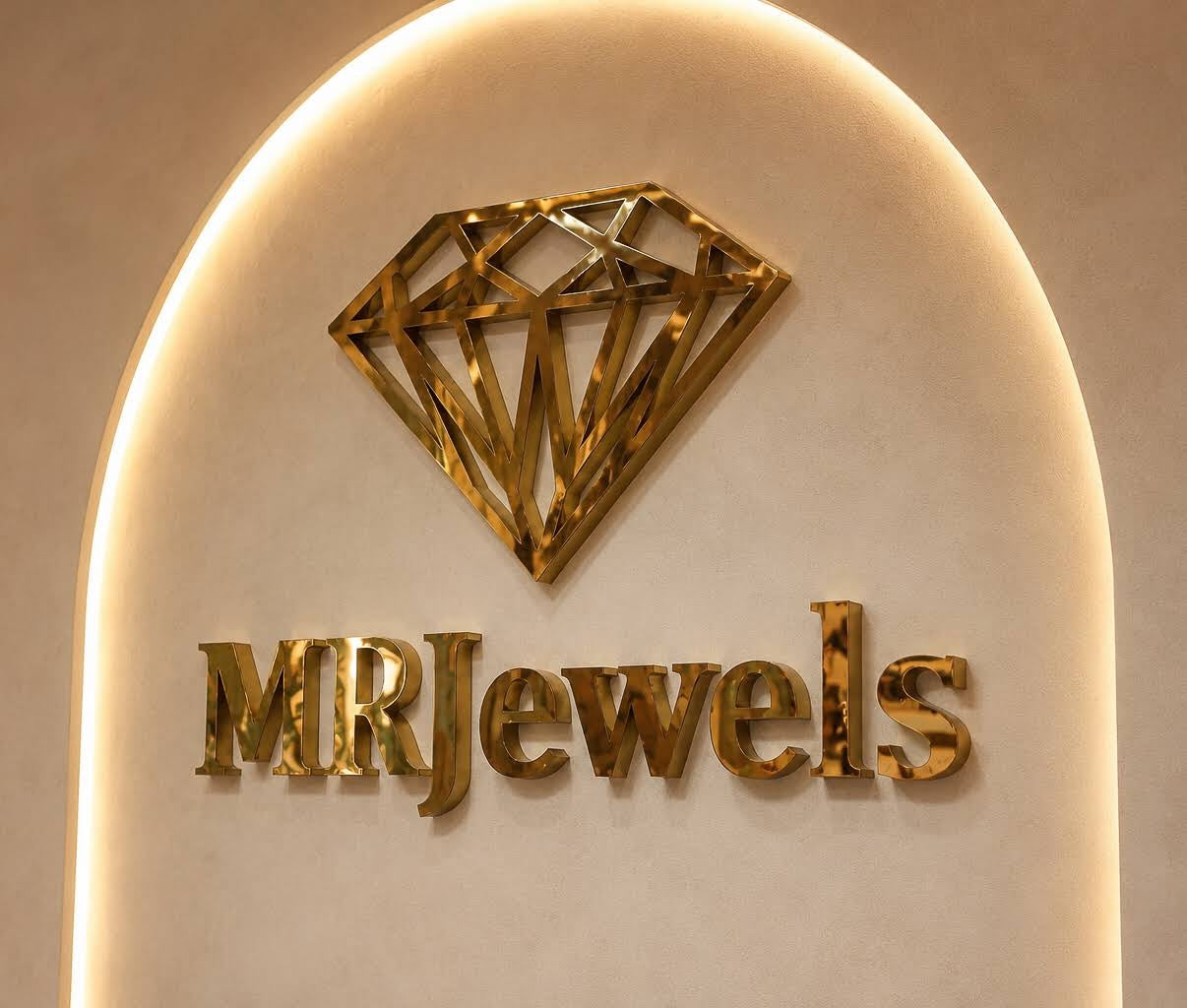 Illuminated MRJewels diamond emblem and logo on the showroom wall
