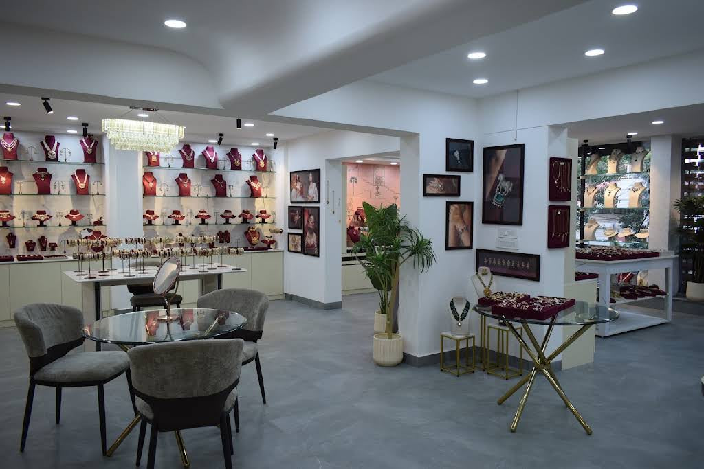 Wide view of the MRJewels showroom with display walls, tables and seating
